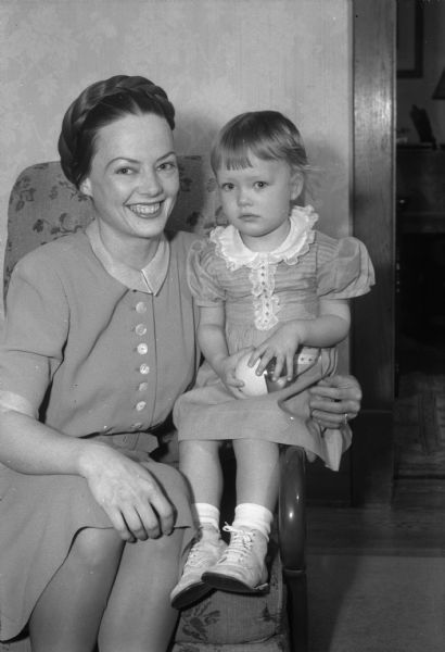 Mrs. J. Frederick (Helen Clark) Bechtel and her daughter Julia, two-and-one-half years old, at the home of her parents, Prof. and Mrs. Warren W. Clark. Her husband is in service.