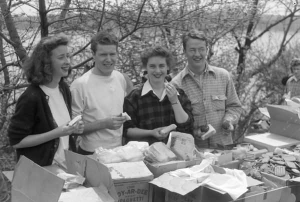 The annual University of Wisconsin-Madison student work day project located at Picnic Point. Shown munching sandwiches and cookies are four of the organizers; left to right: Patricia Schmitz, Barclay Conley, Gay Constantine, and Paul Ipsen.
