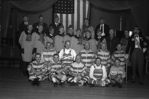 Group portrait of American Legion members dressed in various costumes.