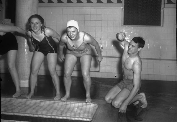 City of Madison Lifeguard Training Class at the YMCA pool, 207 West Washington Avenue. Pictured left to right: Marilyn Hammes, Pat Patterson, and Bill Bailey.