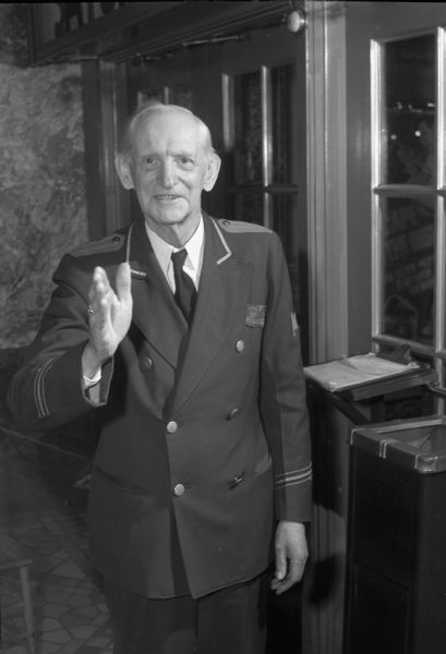 Evan M. Hughes, 68, a war-time replacement as doorman at the Capitol Theatre. Mr. Hughes had a son, Pvt. Robert E. Hughes, who was a prisoner of war by the Japanese during World War II.