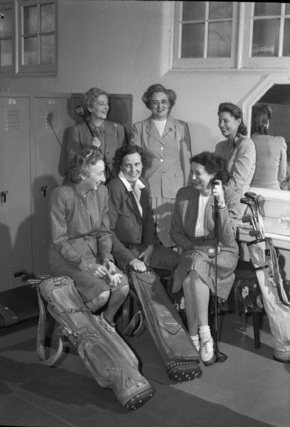 Group portrait of six women golfers at the Maple Bluff Country Club.
