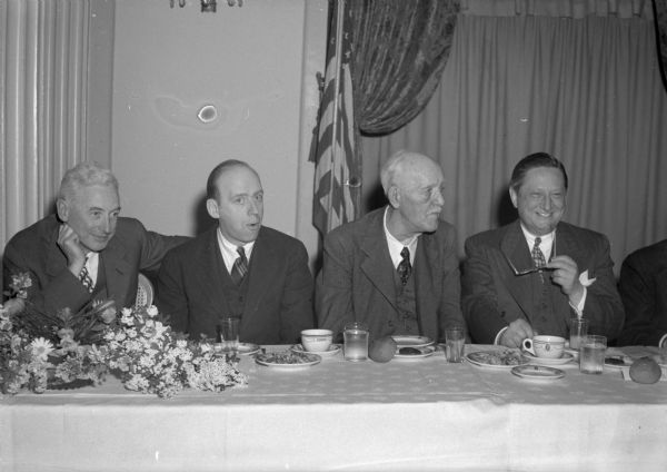 Group portrait of four prominent Republicans at the testimonal dinner given for Thomas F. Coleman, chairman of the Republican voluntary committee, at the Loraine Hotel. Pictured left to right: Mr. Coleman; Herbert Brownell, Jr., chairman of the Republican national committee; Governor Walter S. Goodland; and Cyrus L. Phillip, Milwaukee, national committeeman from Wisconsin.