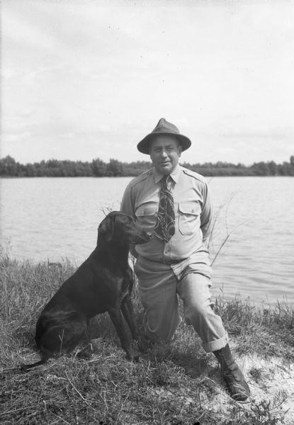From the newspaper caption: Tony Bonovich's [dog,] "Nigger of Upham" won the Derby retriever trial Sunday [June 17, 1945] in Vilas Park. He is shown here with his handler Charles Morgan of Random Lake.