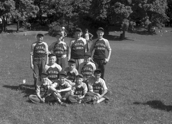 Group portrait of Pertzborn Plumbers Boys' baseball team.