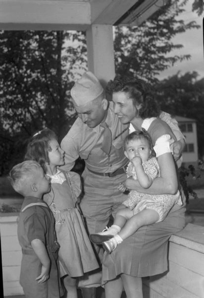 Pvt, Ervin M. Lichte, 122 North Street, and his family, left to right: Frederick, 4; Helen, 6; Pvt. Lichte; Mrs. Lichte (Irma) holding Judith, 2. Pvt. Lichte has just returned home from Camp Grant in Rockford, Illinois.