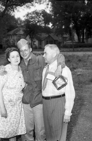 Pfc. Howard A. Endres with his parents, William & Dorothy Endres, home on furlough after Victory in Europe Day to visit his parents at 25 S. Charter Street. After his furlough, Endres was sent back to active duty in the Pacific Theater until the end of the war a couple of months later.