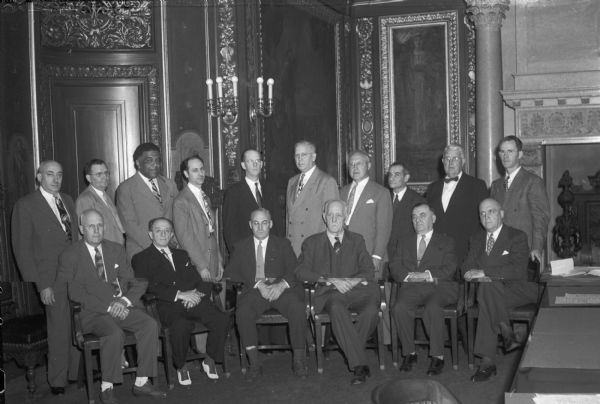 Members of the new Governor's Commission on Human Rights which will promote tolerance on a statewide basis and fight prejudice and hate. Shown left to right:  Dr. R.C. Williams, Superior; Bert C. Broude, Milwaukee; Judge Fred McEvans, Madison, who was named chairman; Governor Walter S. Goodland; Angus Reisweher, Milwaukee, vice-chairman and President E.B. Fred, University of Wisconsin.
Standing left to right: S.L. Goldstine, Madison, Secretary; Jacob Freiderich, Milwaukee; James W. Dorsey, Milwaukee; Hy Cohen, Milwaukee; the Reverend Alfred W. Swan, Madison; Harrison U. Wood, Racine; Leonard J. Kleczka, Milwaukee; Professor Selig Perlman, Madison; Victor J. Stamm, Milwaukee and Allan J. McAndrews, Madison.