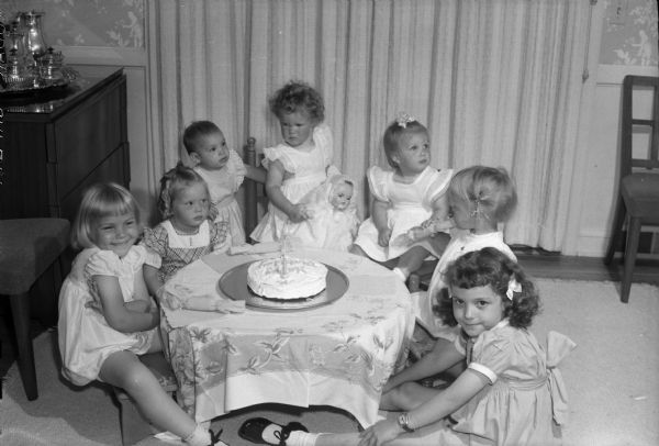 Cynthia Harley celebrates her second birthday with seven young girls. She was born July 13, 1943, daughter of University of Wisconsin Radio Director William G. and Jewell Harley.