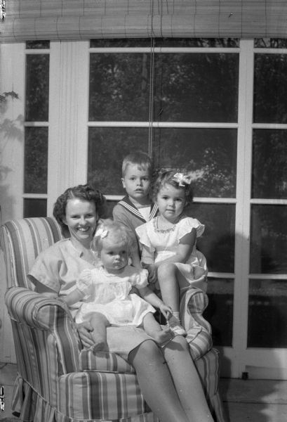 Mrs. W. Llewellyn (Janet) Millar and her three children, Dean (6), Janet (4), and Mary (1), who are staying with her mother, Mrs. Joseph Dean (Minnie Karstens Dean), while her husband is in military service.