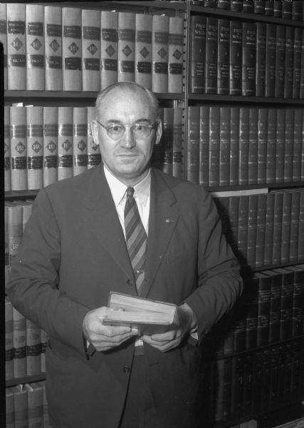 Portrait of Fred M. Evans, Dane County Court Judge and chairman of the Governor's Commission on Human Rights.