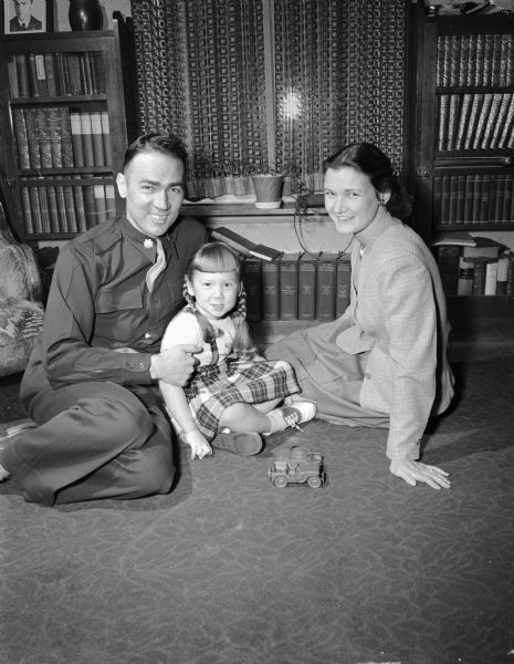 Major William N. Donovan with his wife and daughter. He had just returned to Madison after 39 months as a Japanese prisoner. Their daughter, Josie, was born in Manila.
