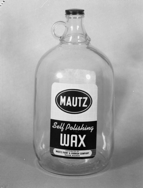 Glass container for Mautz Self Polishing Wax for Mautz Paint and Varnish Company.
