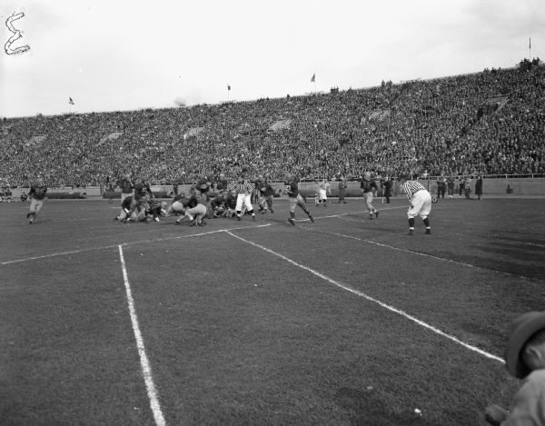 George Fuchs scoring a touchdown for the University of Wisconsin-Madison against the University of Illinois at Camp Randall Stadium. The game was the 25th annual Dad's Day football game.