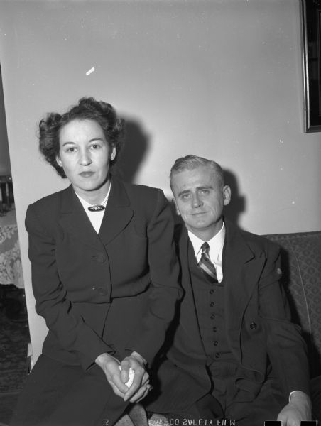 Frederick couple seated in their home.
