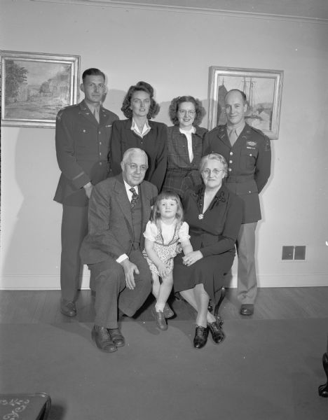 Seated are Mr. and Mrs. Roy F. Bergengren Sr., with their granddaughter, Kathleen Hartman. Standing are Mr. and Mrs. (Rosemary) Roy F. Bergengren Jr., and Mr. and Mrs. (Dorothy Bergengren) Edward Hartman. The two young men are in military uniform.