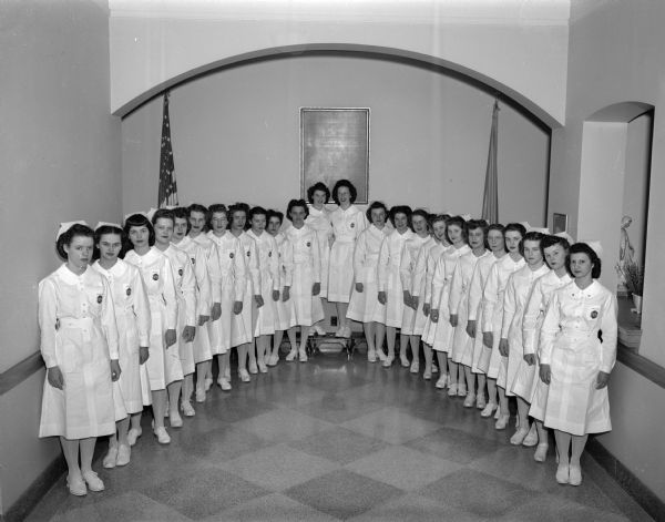 Group portrait of 24 members of St. Mary's nurses class.
