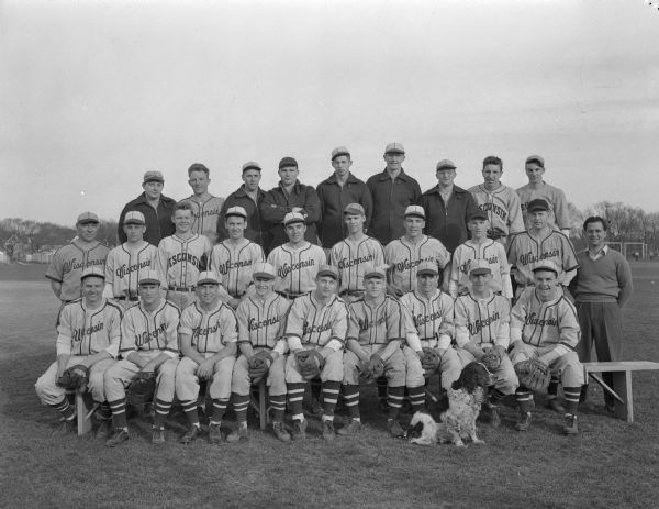 Group portrait of 1946 University of Wisconsin Baseball Squad, with a dog sitting on the ground in front.