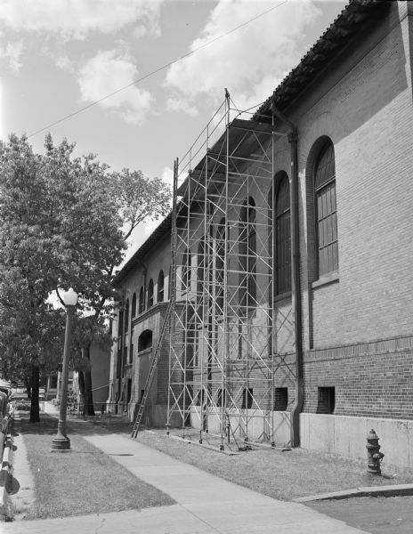 A Safway Steel Scaffold at the Capitol Heat and Power Plant, 624 East Main Street. Safway Steel Scaffolds Company, offices at 940 Williamson Street, is an affiliate of the J.B. Drives Fuel Company.