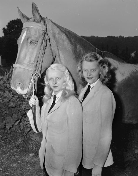 Betty Lou (left) and Sue (right) Thronson, 251 Langdon Street, with their horse Gallant Lad.