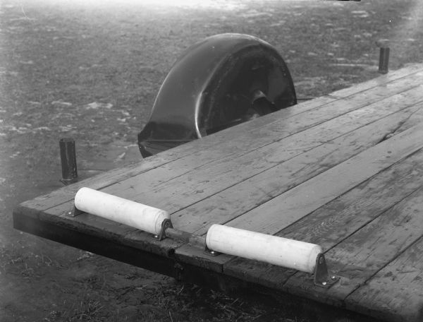 A boat roller, to be mounted at the end of a pier to make it easier to pull a boat out of water.