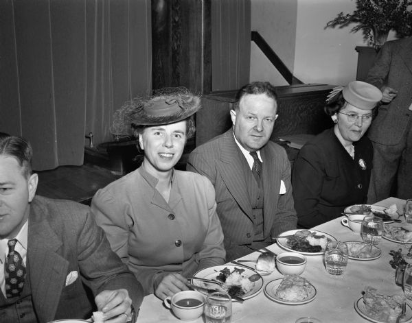 Mr. and Mrs. Ellis H. Dana sitting at a table with another couple at the annual dinner of the Wisconsin State Council of Churches.