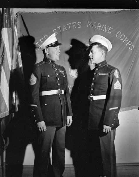 Staff Sgt., Franklin A. Headson, left, wearing new style dress Marine Corps uniform.  Staff Sgt. Morris C. Owens, right, wearing old style dress uniform.