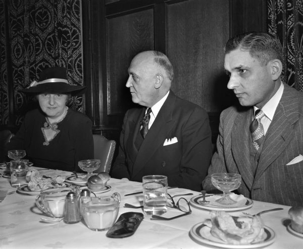 The 98th Founder's Day dinner at the Memorial Union, where a campaign was announced to raise five million dollars for the improvement of the lower campus of the University of Wisconsin-Madison. Shown left to right: Mrs. E.B. (Rosa) Fred, wife of the University president; President Edwin B. Fred, and Walter Frautschi, president of the Madison Alumni club. 
