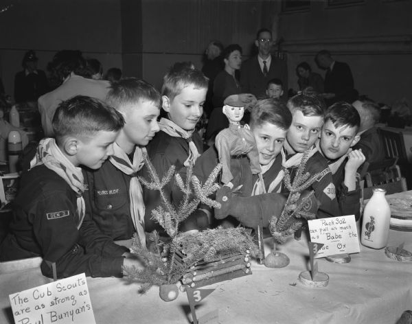 Six den members of Cub Scout Pack 302 at the first "Blue and Gold" Cub Scout banquet at Randall School, 10 North Spooner Street. Left to right: Paul and Peter Mortenson, sons of Mr. and Mrs. W.P. Mortenson, 1932 West Lawn Avenue; Richard Chambers, son of Mr. and Mrs. E.L. Chambers, 2114 Madison Street; Herman Herkert, son of Mrs. F.H. Herkert, 1909 Keyes Avenue; Steve Zwicky, son of Mr. and Mrs. E.H. Zwicky, 2108 Keyes Avenue, and Jim Allen, son of Mr. and Mrs. N.M. Allen, 1901 West Lawn Avenue.