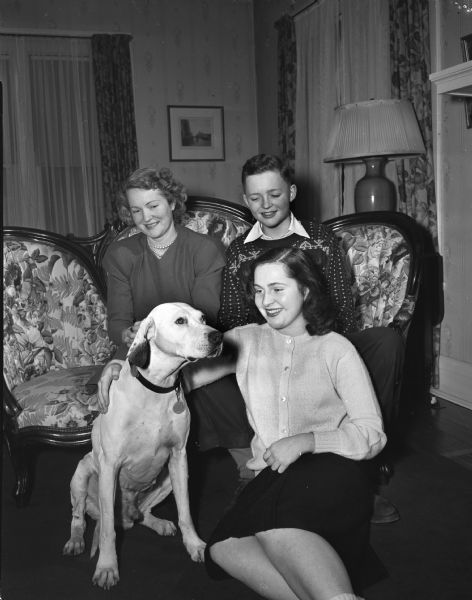 Newcomers to Madison are: Mrs. Wesley S. (Leona) Walker; children Peter, and Jackie; and the family's dog, Renny, a white English Pointer.