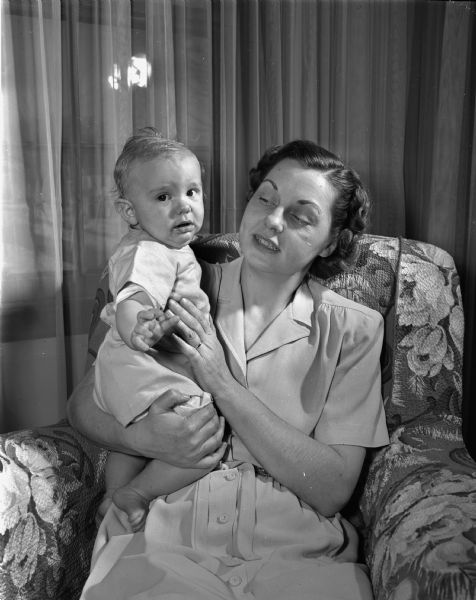Pictured are newcomers to Madison, Mrs. John W. (Evelyn) Brown, 2643 Van Hise Avenue, and her six-month-old son, John Christian.