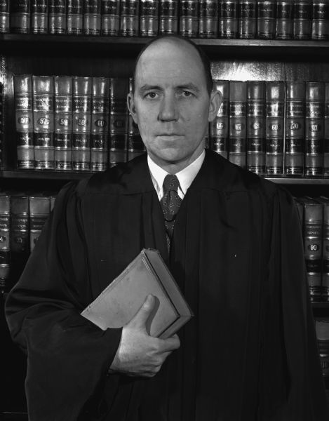 Portrait of James Ward Rector, appointed to the Wisconsin Supreme Court in 1946 and now seeking election to the court.