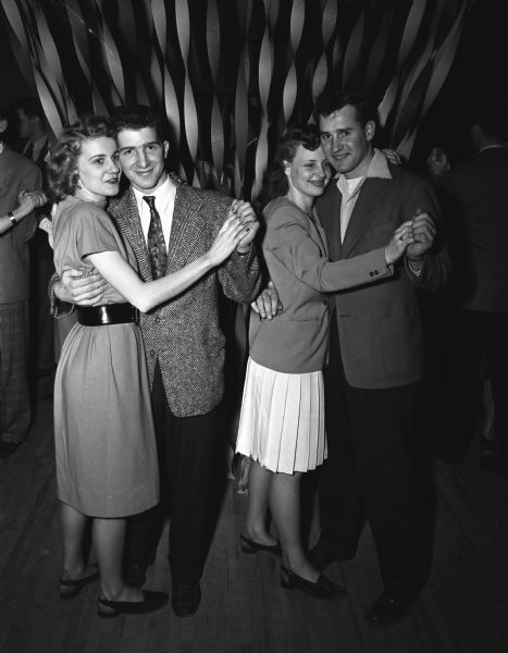 Young Adult Club 1st Anniversary dance in the Community Center. Dancing on the ballroom floor are: left to right, Mary Imhoff and Joe Prestigiacomo, and Marian Siewert and John De Smidt.