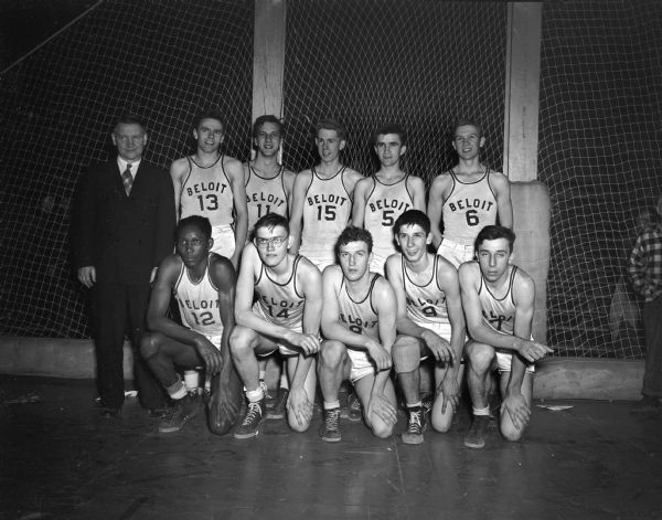 Group portrait of Beloit High School boys basketball team that won the WIAA State High School Basketball Tournament.  Included on the team was an African American, Art Parker.
