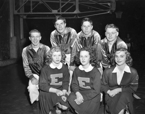 Madison East High School Cheerleaders at the WIAA State High School Basketball Tournament.  Front row left to right: Erma Borland, Noreen Walker, Lyle Leverentz, Don Borland.