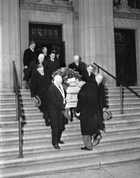 Pallbearers carrying the casket of Governor Walter Goodland from the Madison Masonic Temple.