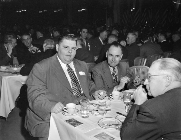 Pictured at Wisconsin Legislative banquet, left to right: Clifford "Tiny" Krueger, Republican senator from Lincoln and Marathon Counties, and two unidentified men. Banquet was sponsored by the Madison and Wisconsin Foundation.