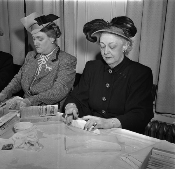 Two women volunteers preparing mailing for Glenn Davis, Waukesha, a candidate for the second district congressman at the Republican headquarters in the Loraine Hotel. From left to right are Mrs. Charles E. Hemingway, and Mrs. Robert K. Henry. Mrs. Henry is the widow of the congressman who died after election in November and whom Davis hopes to succeed.