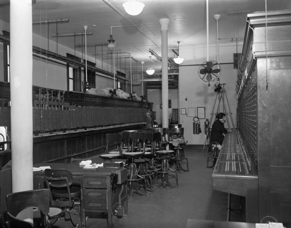During the national telephone strike, one operator is present in the east switchboard room at Wisconsin Telephone Company, 16 South Carroll Street.