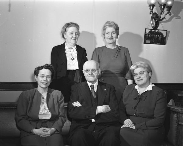 Group portrait of Eugene E. Brossard and four unidentified women. Mr. Brossard was best known as the reviser of Wisconsin statutes.