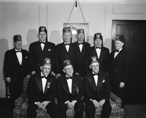 Group portrait of nine Zor Shrine officers in uniform.