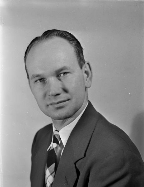 Portrait of a man with a plaid tie.