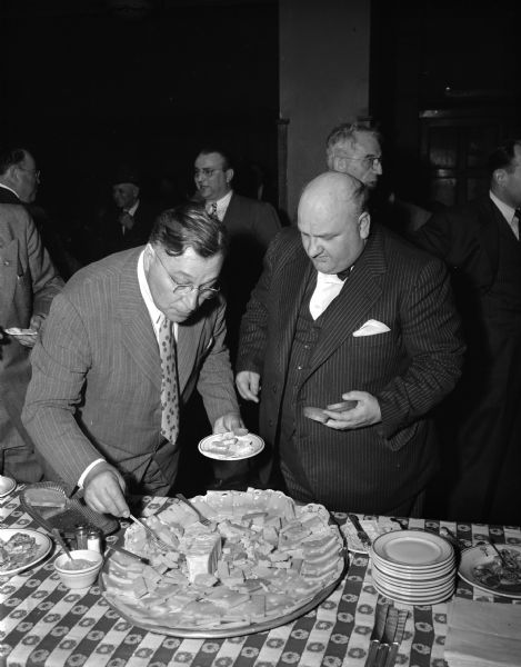 State Senator Rudolph Schlabach (R - La Crosse) with another man at a legislative dinner sponsored by the Wisconsin Cheese Makers Association.