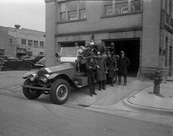 1922 Pumper Fire Truck at old Fire Station No. 2 (1921-1966), 301 N. Broom Street.  Firemen (l to r) Harold Muenkel, Charles White, Alex Cohn, Lt. Wilber Koch, Harold Dennis, and Charles Gilbert.