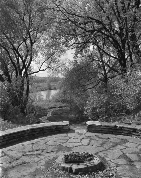 The stone council circle in the University of Wisconsin-Madison Arboretum. It was built by noted landscape architect and bereaved father, Jens Jensen, as a memorial to his son.