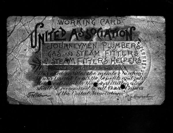 Fifty-year-old Plumbers Union card, the first issued by the Madison Plumbers Union, Local 167, in 1897. Shown are signatures of Walter J. Hyland, secretary of the union (current Postmaster), and Dave J. Nelson, the local's first president.