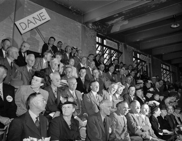 Dane County delegation at the State Republican Party convention, seated in the stands at the University of Wisconsin-Madison Stock Pavilion.