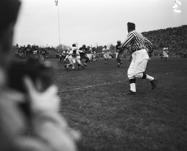University of Wisconsin football player Clarence Self, #18, carrying the ball during the UW vs. Northwestern football game.