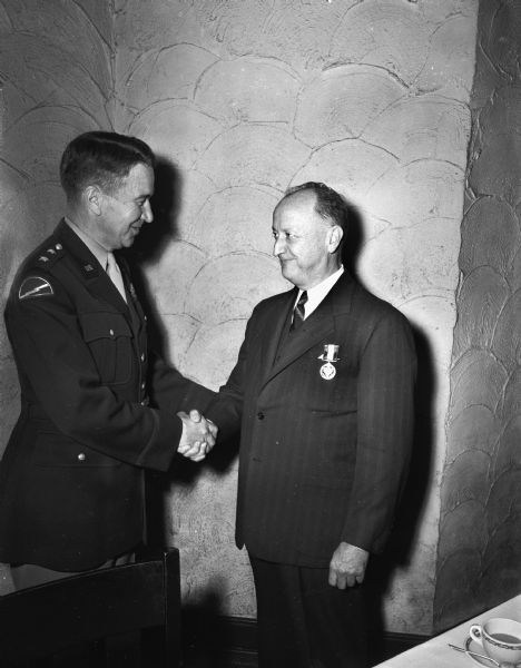 Dr. William S. Middleton receiving the Distinguished Service Medal from Major General Edwin P. Parker for outstanding service with the Army Medical Corps in Europe during World War II.