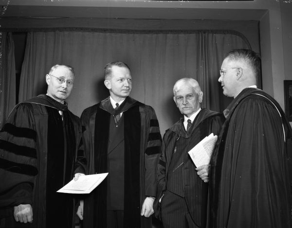 Left to right are the Rev. J. Pierce Newell, Madison, superintendent of the southern Wisconsin district of the Western Wisconsin Conference of Methodist churches; Dr. Merrill R. Abbey, pastor of the First-University Methodist church; Bishop Edwin H. Hughes; and the Rev. Clifford Fritz, Watertown, superintendent of the Watertown district of the Wisconsin conference. They are at a recognition service in honor of Bishop Hughes.